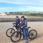 Ebike Hire Sussex - Couple Riding on the Beach