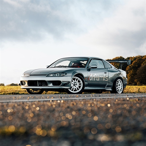 Nissan S15 Driving viewing car from the front on track thumbnail