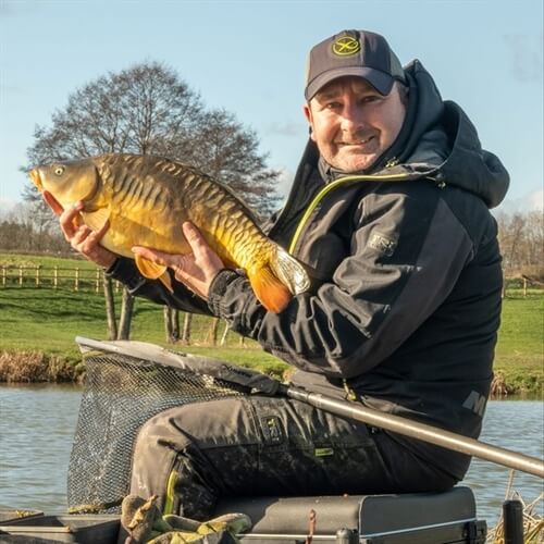 Fishing Lessons in Yorkshire & Nottinghamshire - Fisherman Holding Large Fish  Fishing Lessons in Yorkshire & Nottinghamshire - Fisherman Holding Large Fish