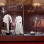 Coronation Gowns on display in the state room in glass cabinet 