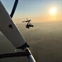 Microlight in the sky in the sunset