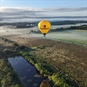 Yellow Hot Air Balloon Flying Over Lake