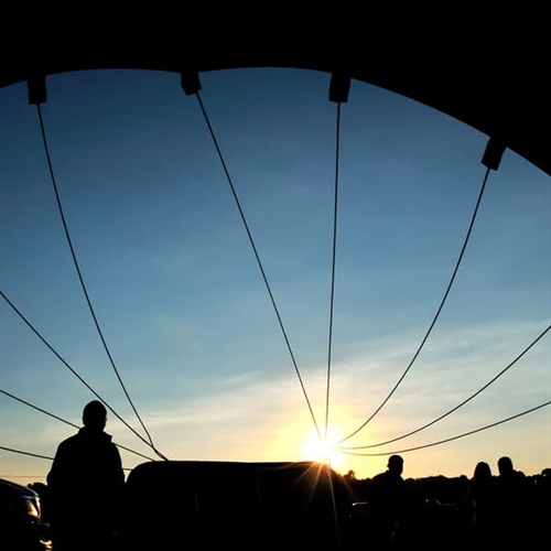 Hot Air Balloon going up in the sunset Hot Air Balloon going up in the sunset