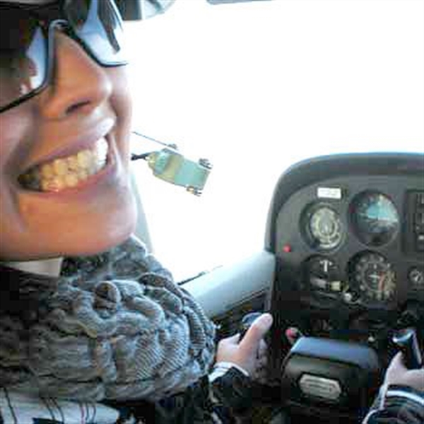 smiling woman on flying lesson