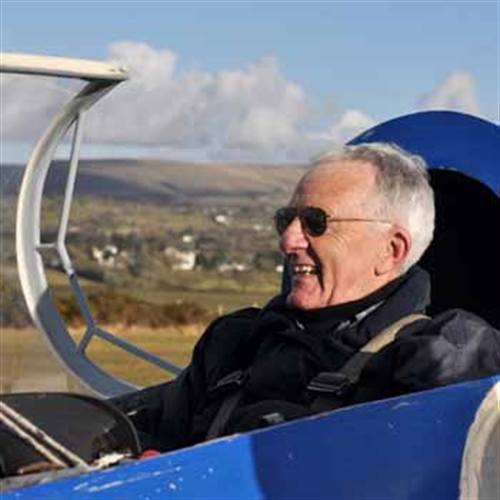 man sitting in a glider man sitting in a glider
