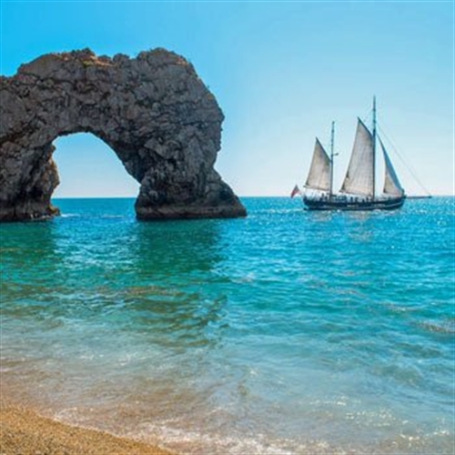 sailing boat and cliff sailing boat and cliff