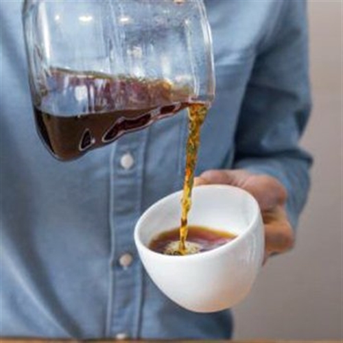 man pouring coffee man pouring coffee