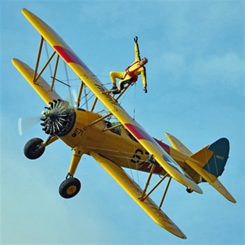 wingwalker and pilot waving wingwalker and pilot waving