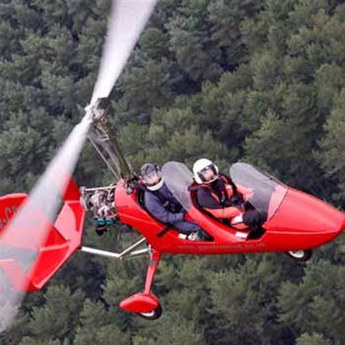 gyrocopter pilot and passenger looking up gyrocopter pilot and passenger looking up