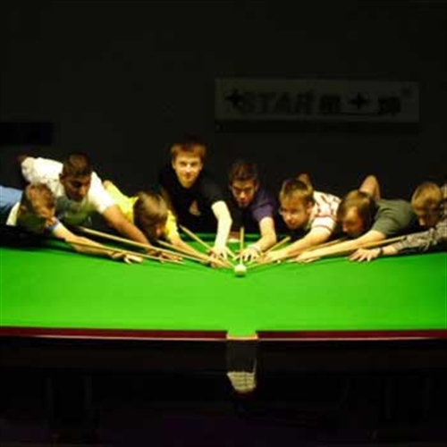 boys around a snooker table boys around a snooker table
