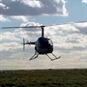 helicopter in front of clouds